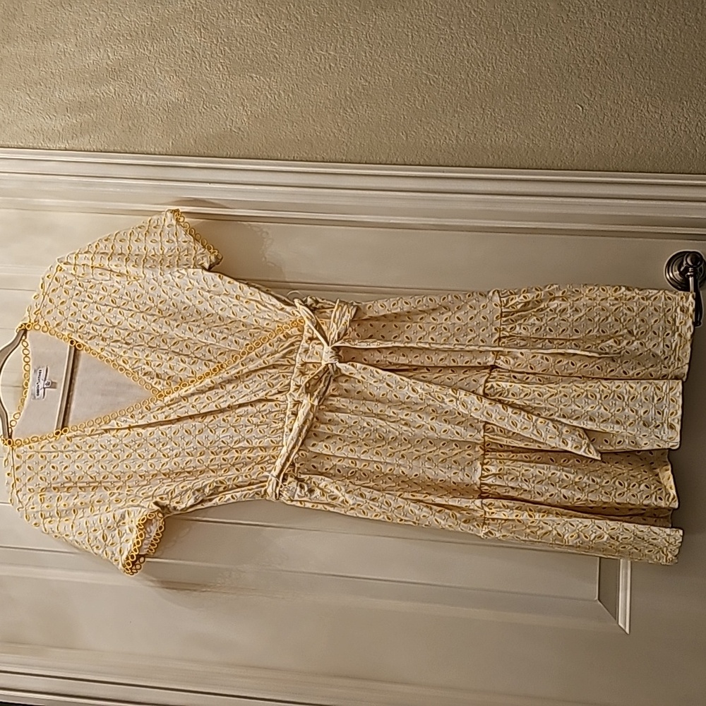 A white/yellow eyelet dress.